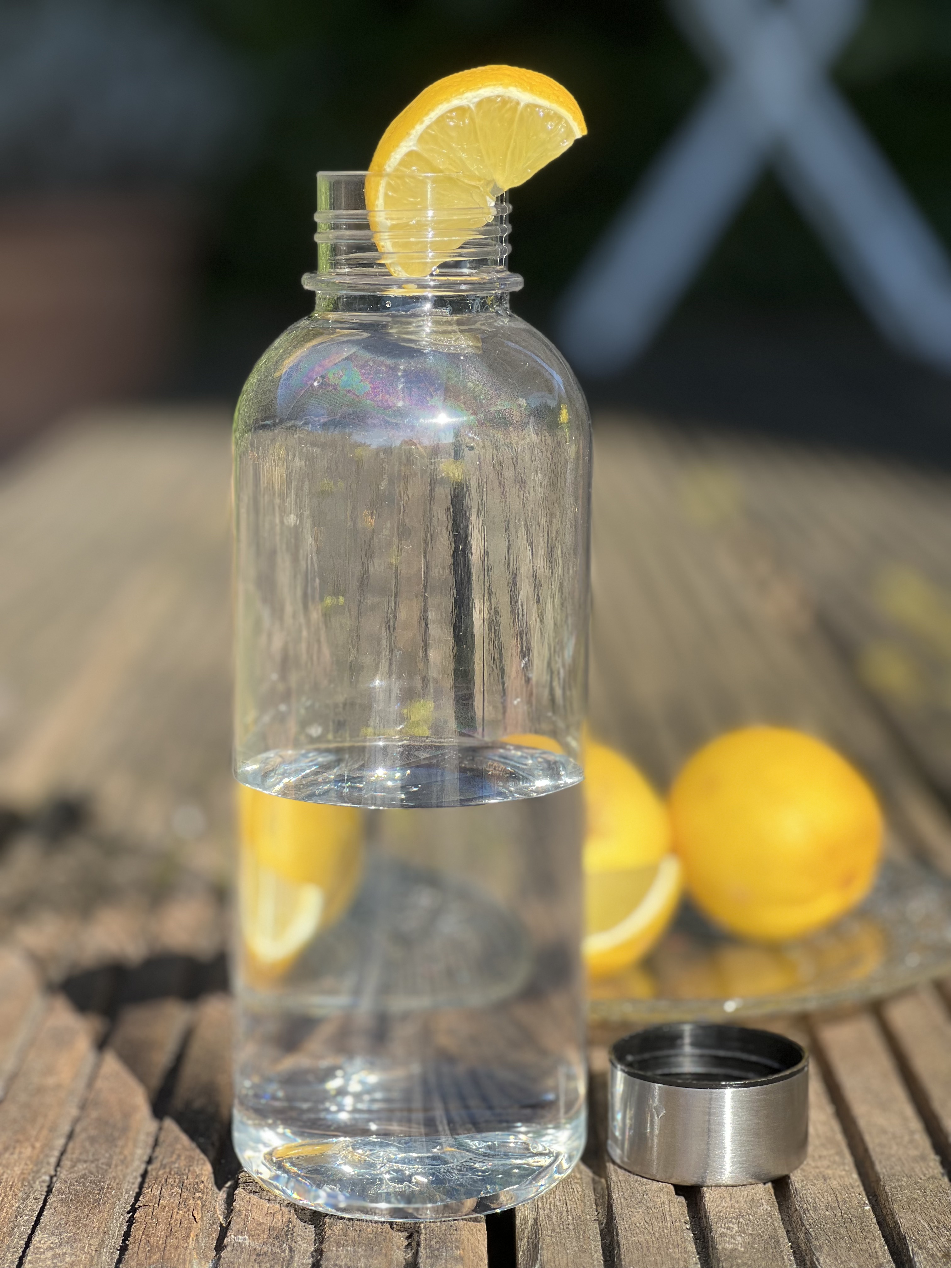 Trinkflasche klar aus recyceltem PET,600 ML, dargestellt ohne Deckel.